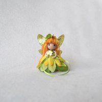 Magical yellow and green fairy doll